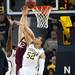 Michigan junior Jordan Morgan attempts to block IUPUI Mitchell Patton's shot on Monday. Daniel Brenner I AnnArbor.com